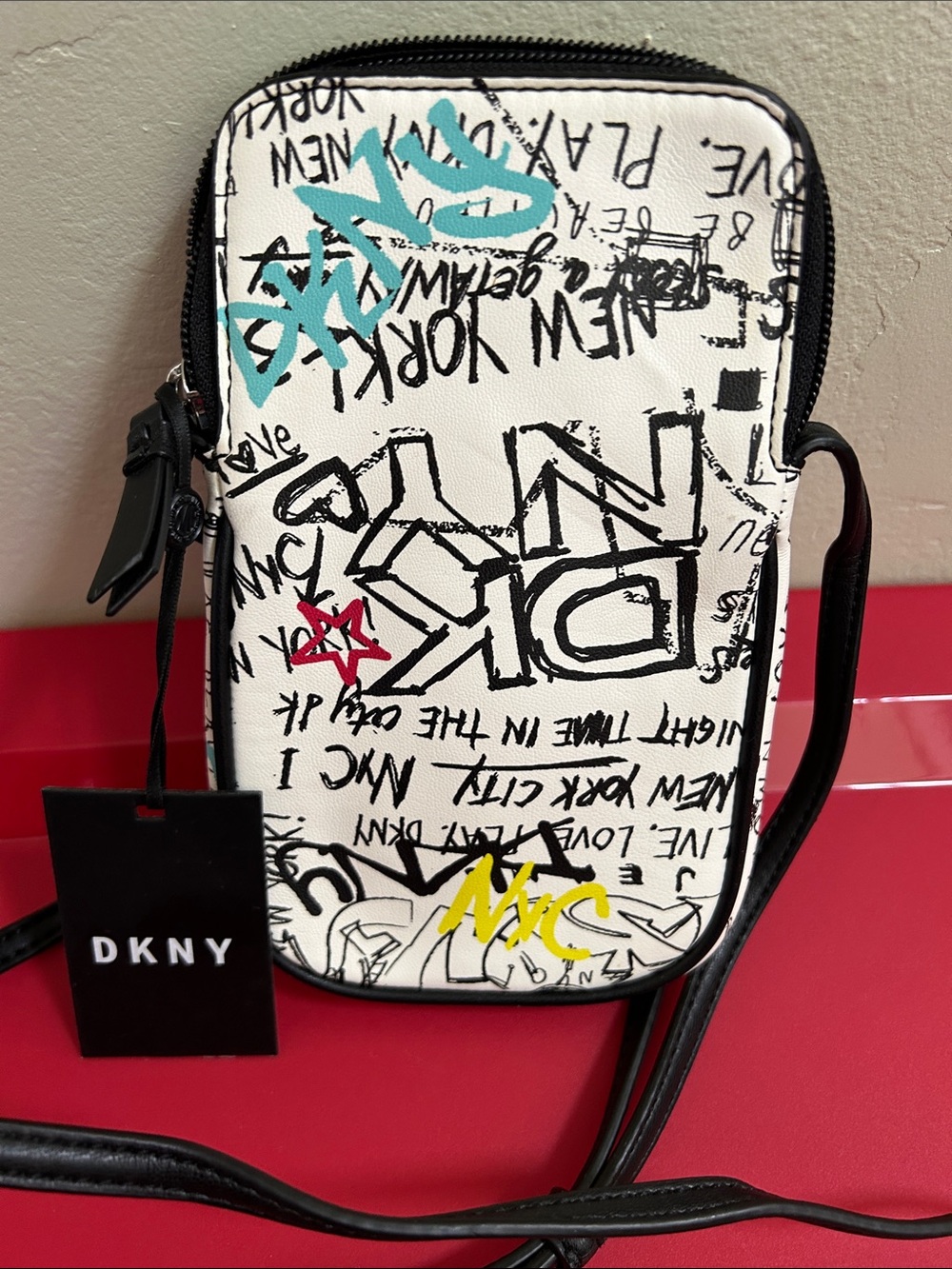 DKNY White Black Graffiti Crossbody Phone Bag with Red and Blue Accents